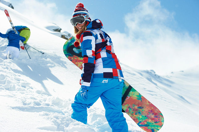 Female snowboarder in snow
